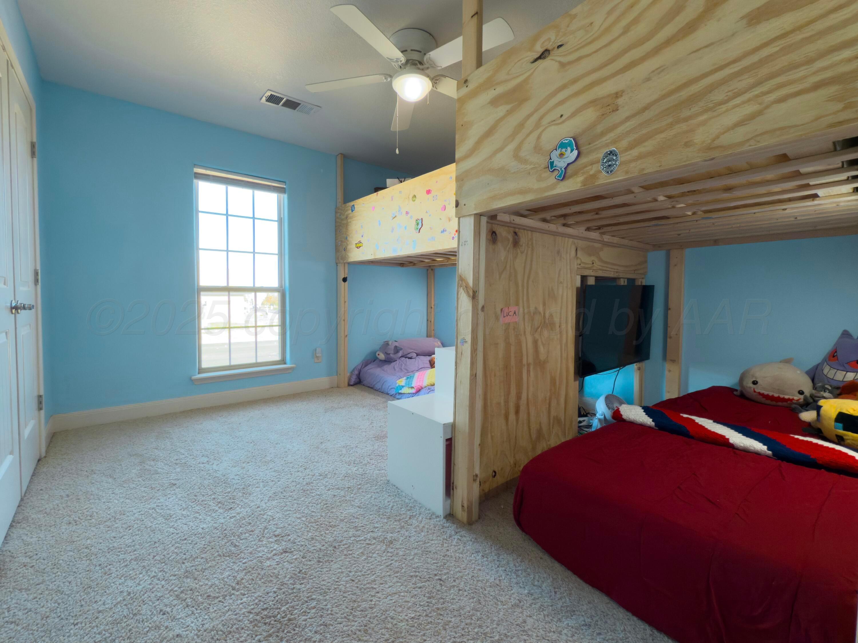 3701 Arden Road Amarillo, TX 79118 - Photo 13 of 18 a bed room with a bed and a window