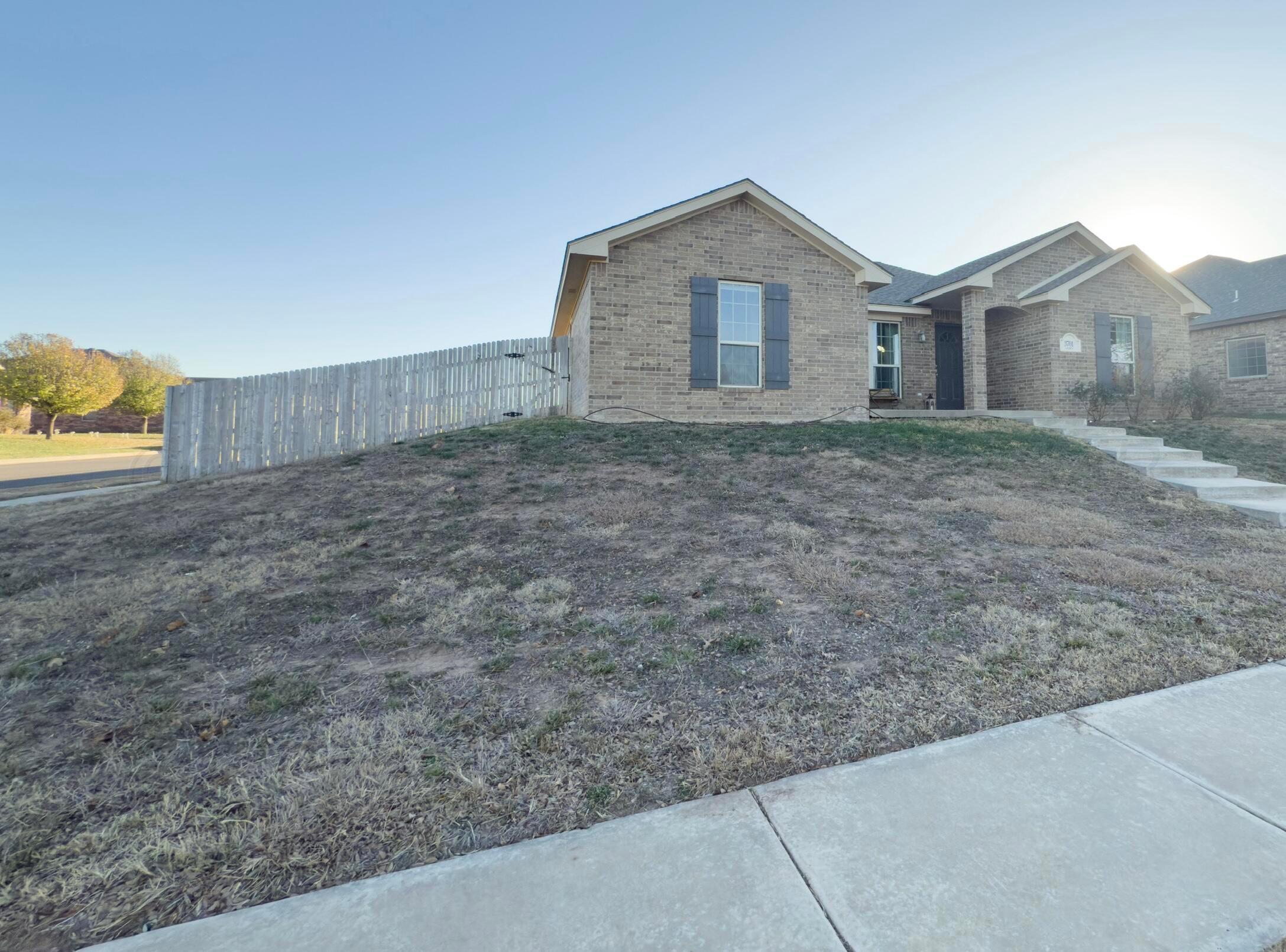 3701 Arden Road Amarillo, TX 79118 - Photo 2 of 18 a view of a house with a yard