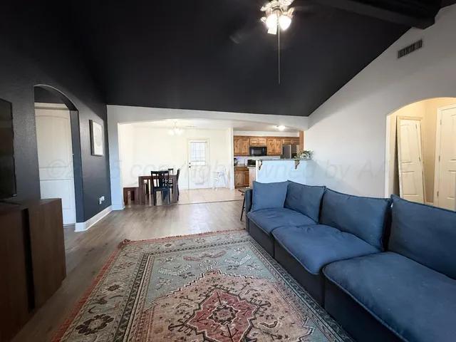 a living room with furniture and a large window