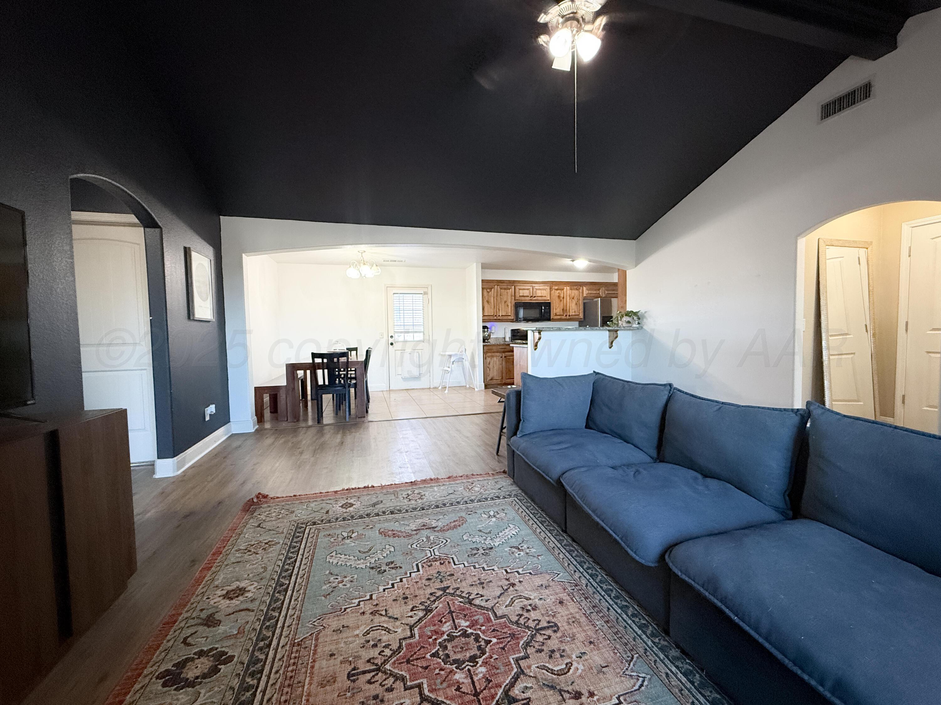 3701 Arden Road Amarillo, TX 79118 - Photo 4 of 18 a living room with furniture and a large window