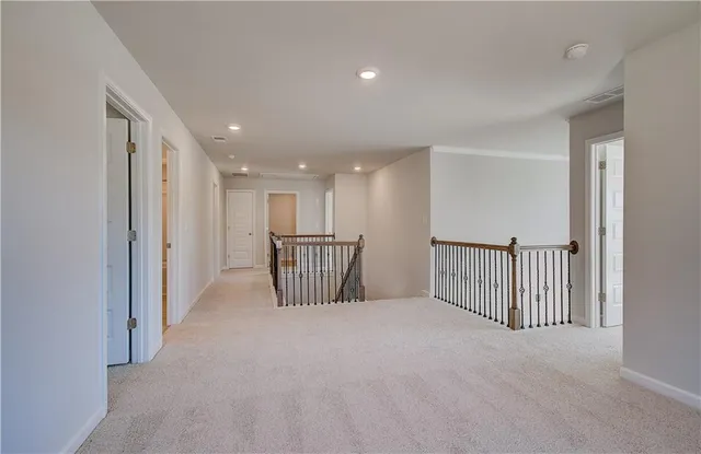 a view of a hallway with a staircase