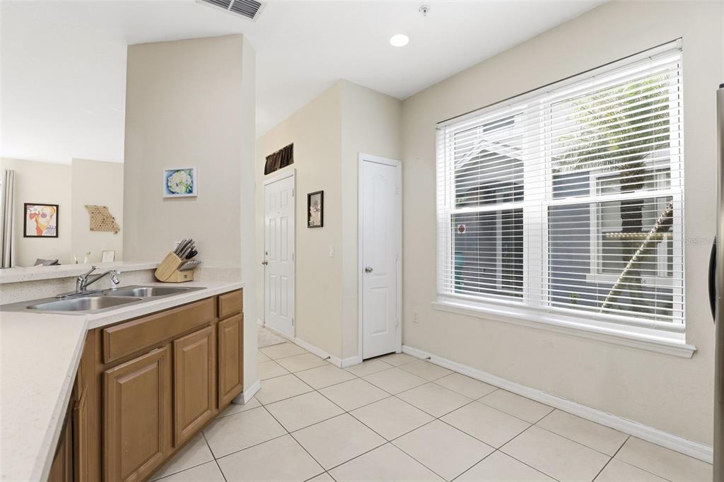 6458 South Goldenrod Road, Unit 29B Orlando, FL 32822 - Photo 16 of 40 a kitchen with a sink cabinets and window