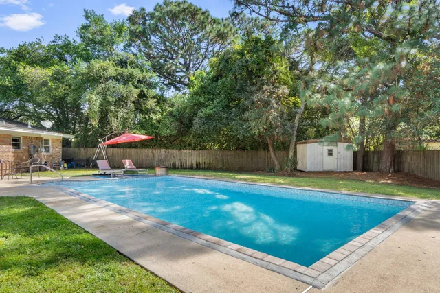 a living room with furniture wooden floor and a flat screen tv