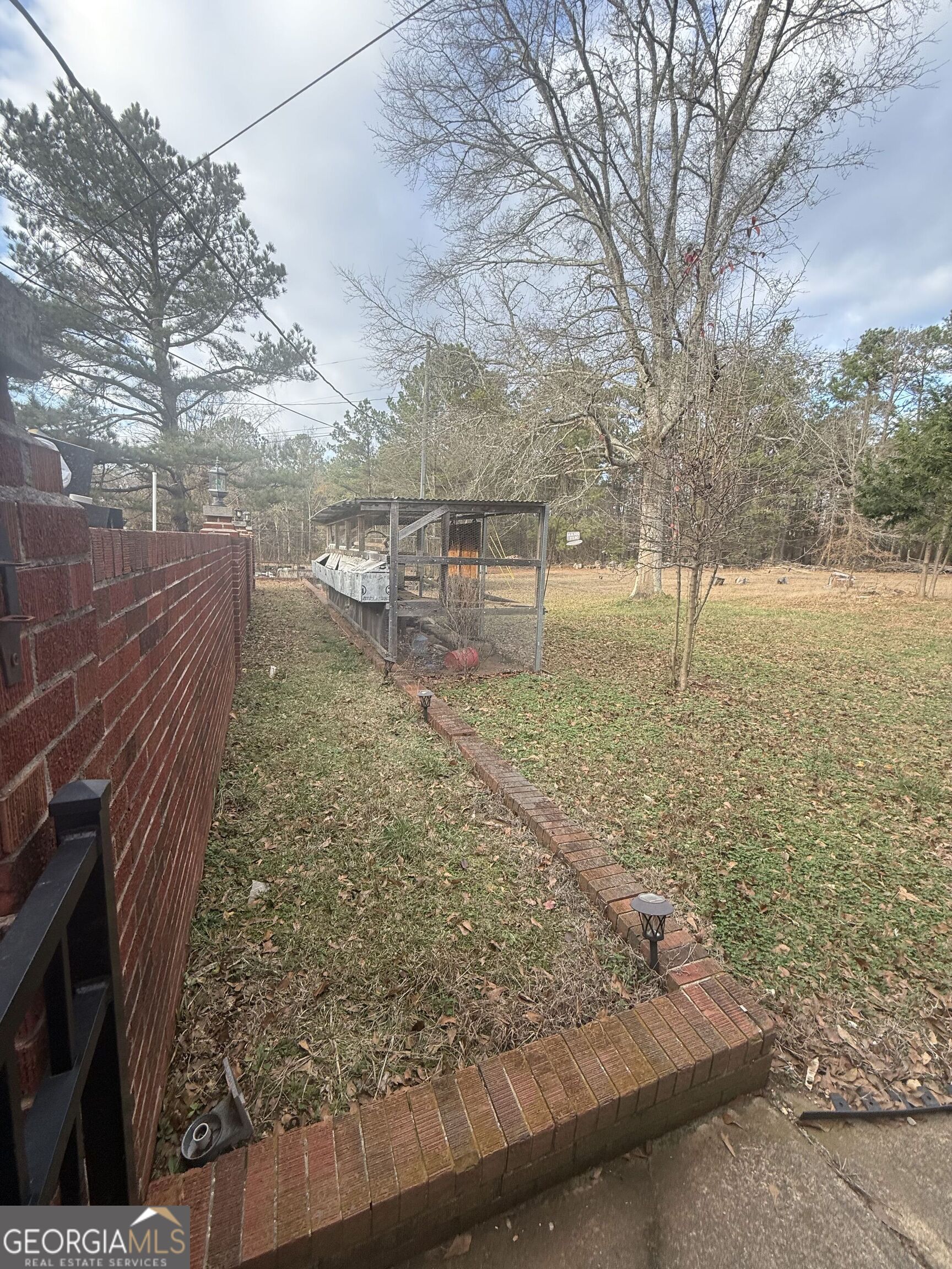 3861 Newnan Road Griffin, GA 30223 - Photo 64 of 89 a view of a yard with an outdoor space