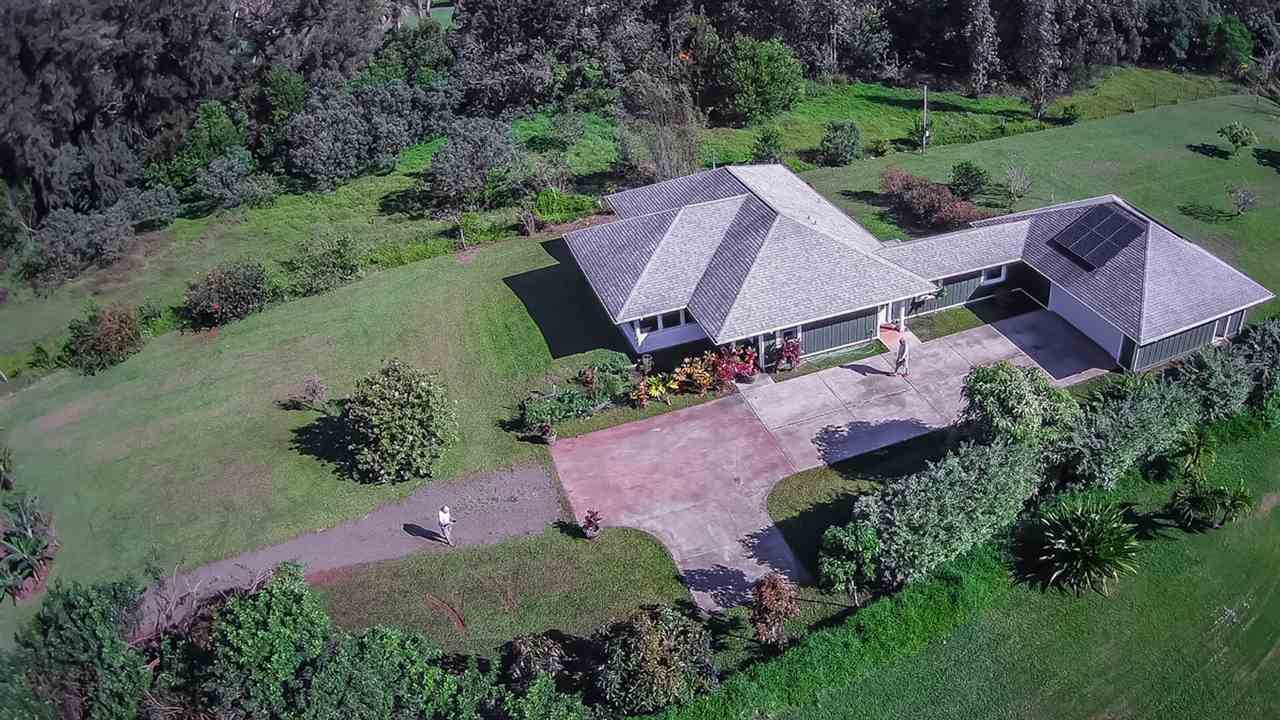 1209 West Kuiaha Road, Unit 2 Haiku, HI 96708 - Photo 1 of 30 an aerial view of a house with garden space and street view