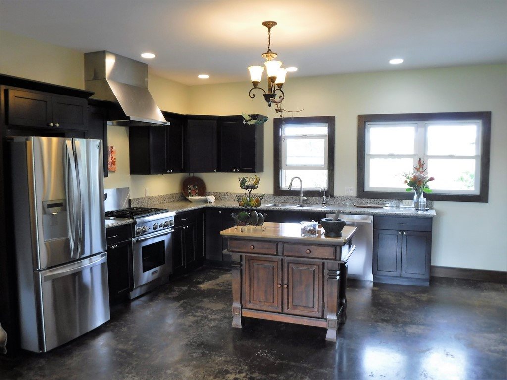 1209 West Kuiaha Road, Unit 2 Haiku, HI 96708 - Photo 11 of 30 a kitchen with kitchen island a sink stove and refrigerator