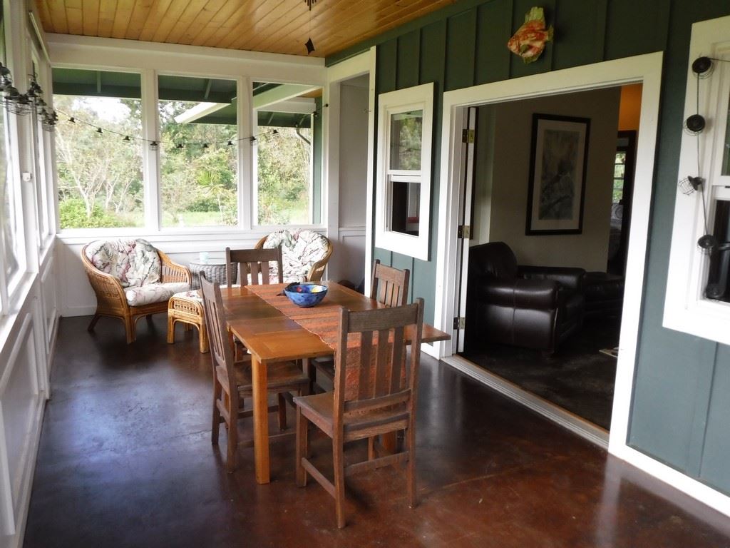 1209 West Kuiaha Road, Unit 2 Haiku, HI 96708 - Photo 12 of 30 a dining room with furniture and wooden floor