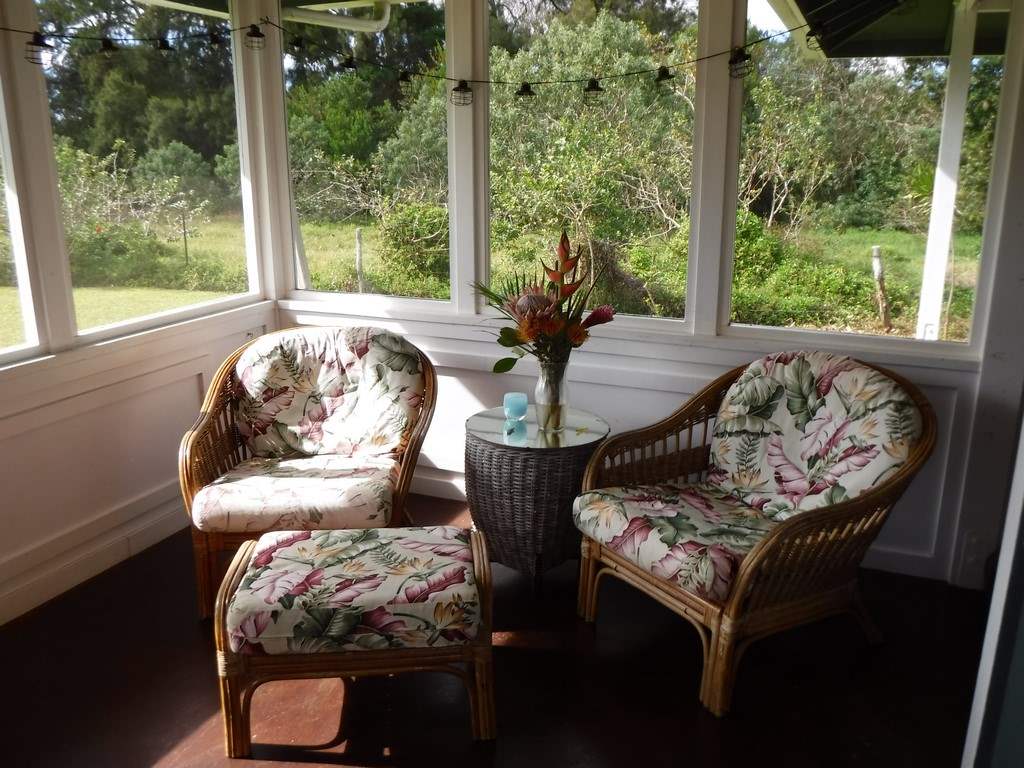 1209 West Kuiaha Road, Unit 2 Haiku, HI 96708 - Photo 14 of 30 a living room with furniture and a floor to ceiling window