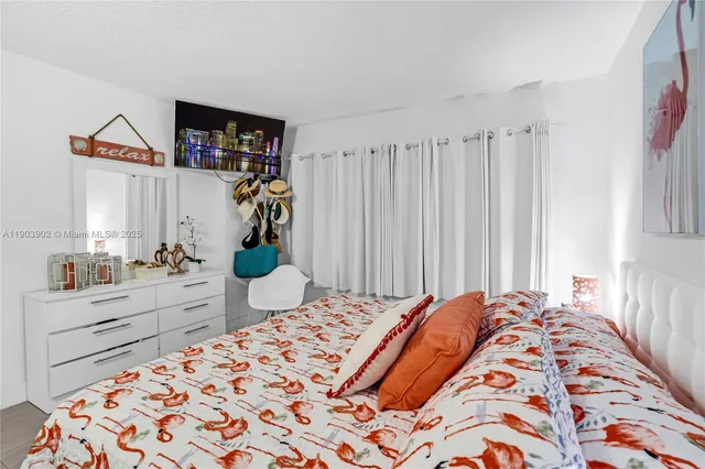 a bed room with a bed and a cabinets