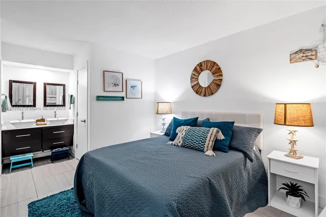 a bedroom with a bed and a desk