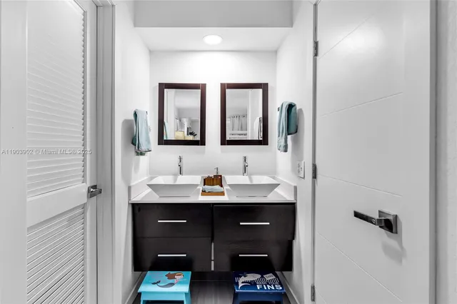 a en suite bathroom with a sink and a mirror