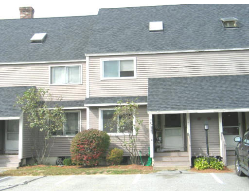 170 Ayer Road, Unit D2 Shirley, MA 01464 - Photo 1 of 1 a front view of a house with a yard