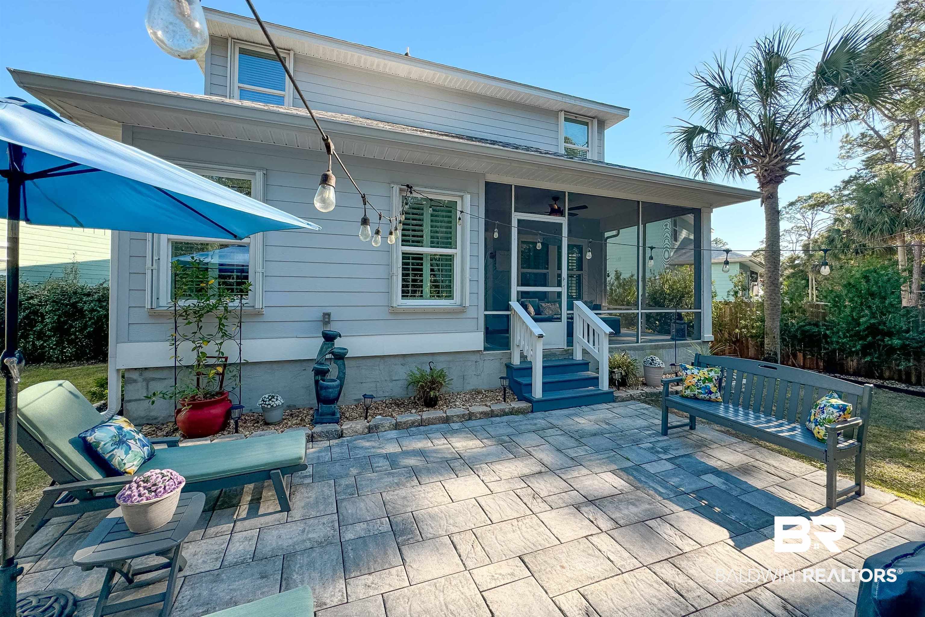1290 Mako Loop Gulf Shores, AL 36542 - Photo 40 of 50 Back of property featuring a sunroom and a patio area
