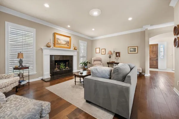 a kitchen with granite countertop white cabinets white stainless steel appliances with a sink and dishwasher