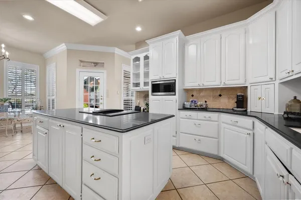 a kitchen with a stove a refrigerator and a sink