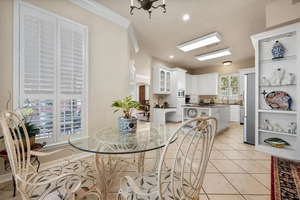 a kitchen with granite countertop a sink stove and cabinets