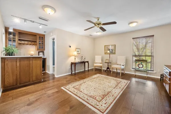a living room with furniture and a rug