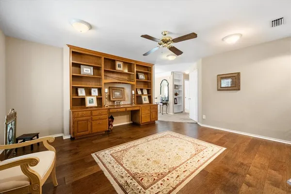 a bedroom with a bed and a chair