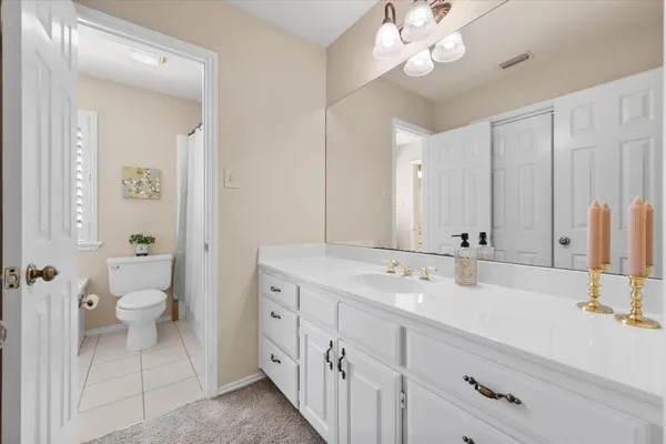 a view of a dining room with furniture and a window