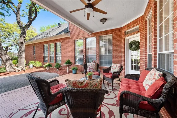a building outdoor space with patio furniture and potted plants