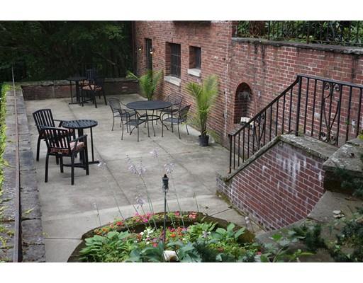 1192 Main Street Athol, MA 01331 - Photo 22 of 30 a view of a patio with couches table and chairs and potted plants