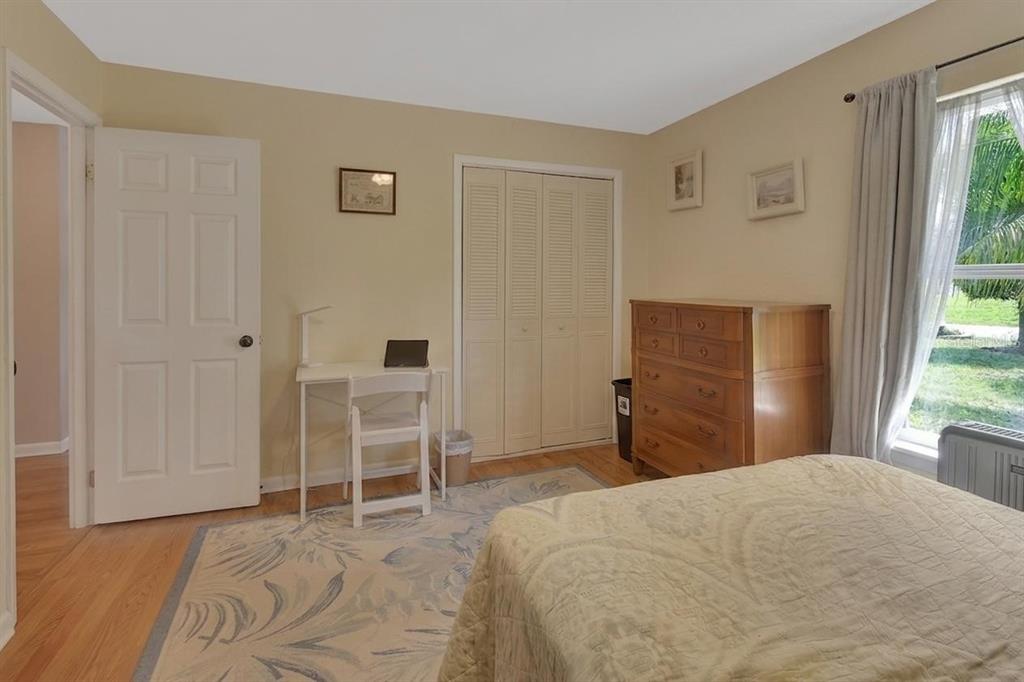 50 Bonita Road DeBary, FL 32713 - Photo 21 of 43 a bedroom with a bed and a chair