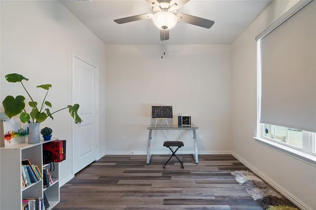a workspace with furniture and a window