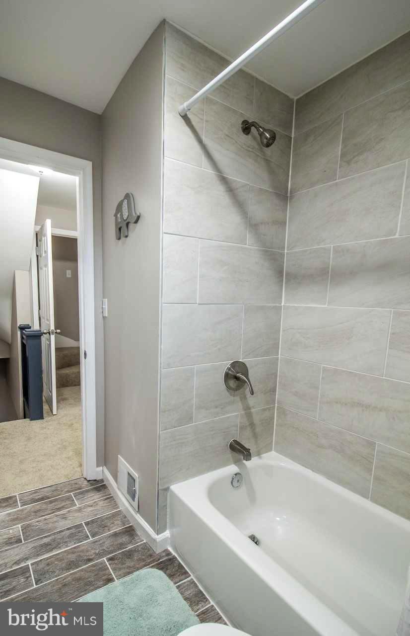 37 Northship Road Baltimore, MD 21222 - Photo 13 of 23 a bathroom with a tub and shower
