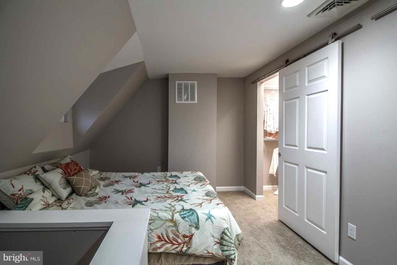 37 Northship Road Baltimore, MD 21222 - Photo 15 of 23 a bedroom with a bed and a mirror
