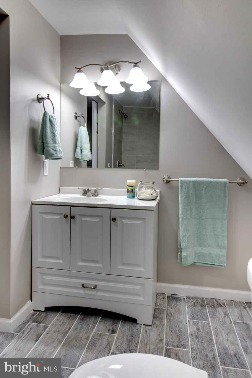 37 Northship Road Baltimore, MD 21222 - Photo 18 of 23 a bathroom with a sink a vanity and a mirror