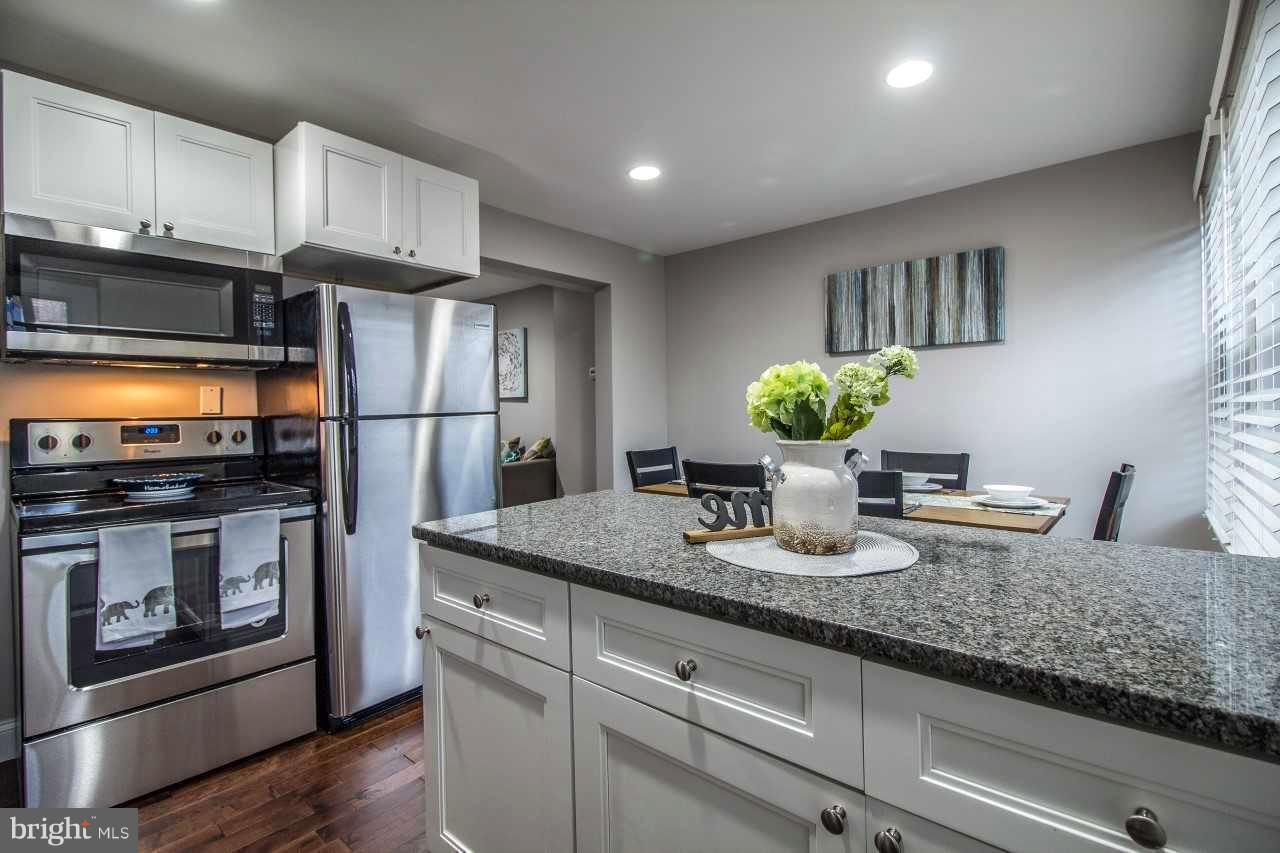 37 Northship Road Baltimore, MD 21222 - Photo 4 of 23 a kitchen with stainless steel appliances granite countertop a refrigerator a stove a sink and white cabinets