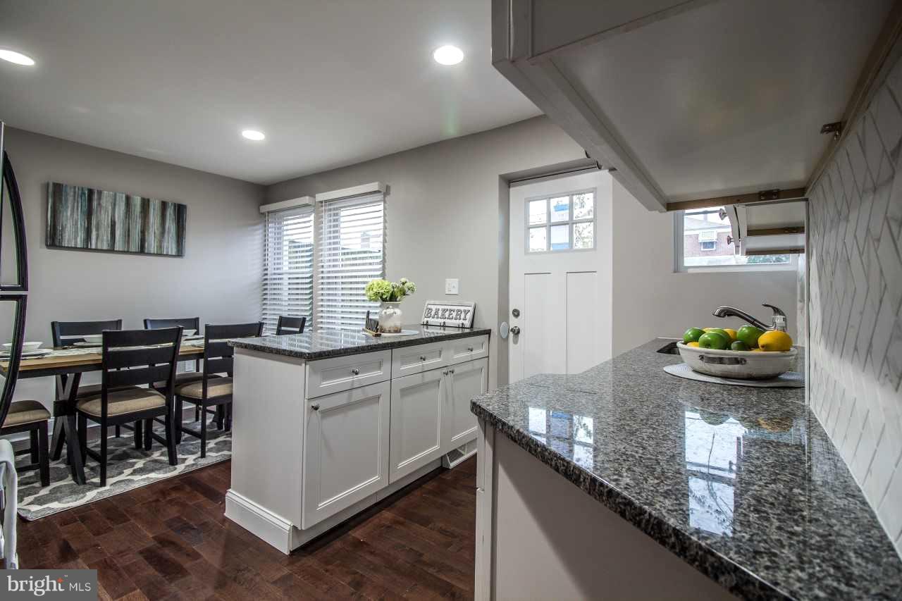 37 Northship Road Baltimore, MD 21222 - Photo 5 of 23 a kitchen with sink and chairs