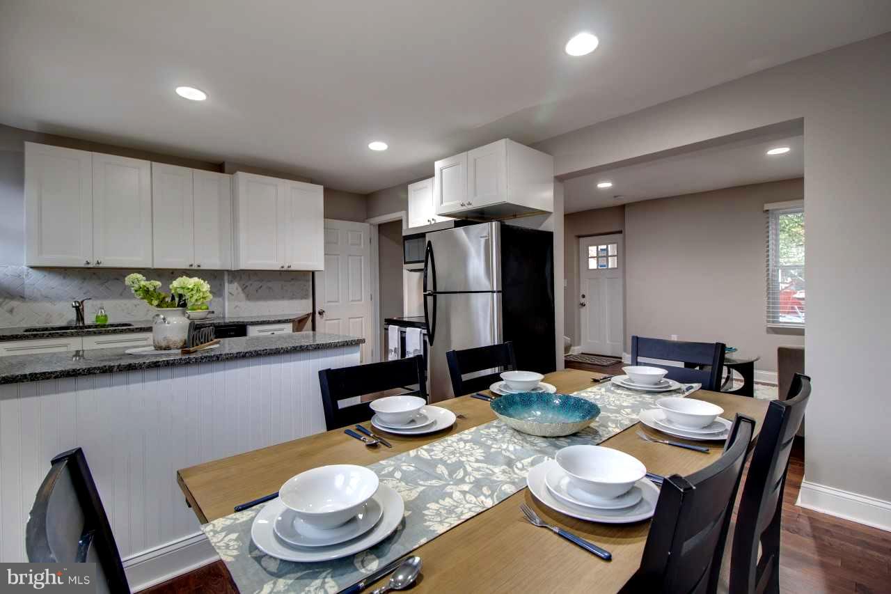 37 Northship Road Baltimore, MD 21222 - Photo 6 of 23 a kitchen with a dining table and chairs