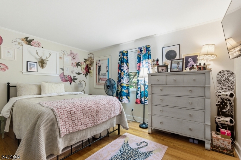 77 Lower North Shore Road Branchville, NJ 07826 - Photo 19 of 38 a bedroom with a bed and a dresser