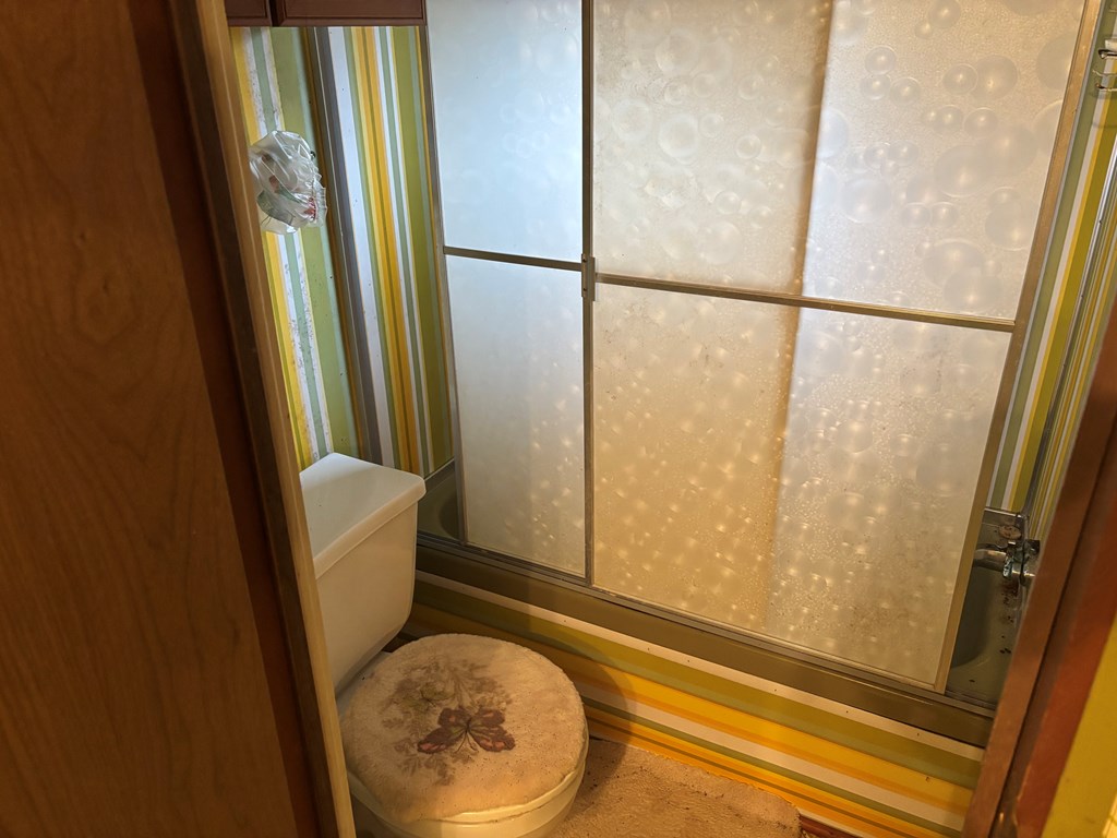 366 Gander Gap Road Hiawassee, GA 30546 - Photo 6 of 13 a view of a bathroom with tub and shower