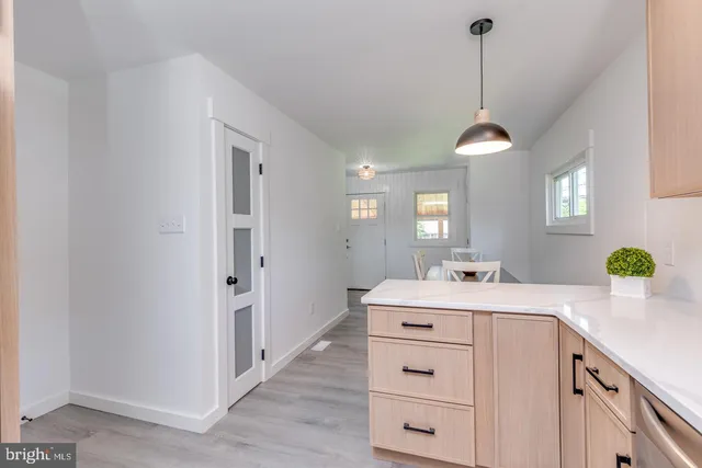 a kitchen with a sink stove and microwave