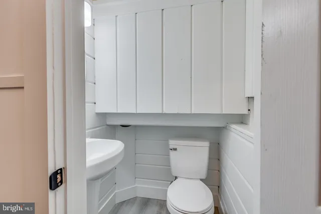 a view of a room with a window and chair