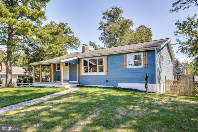 a view of a house with backyard porch and sitting area