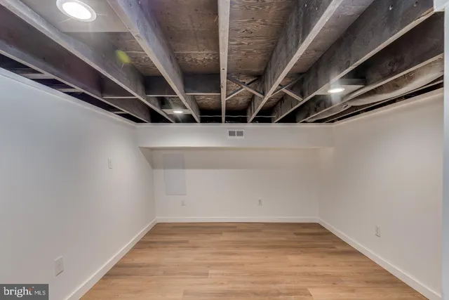 a view of a house with garden and trees