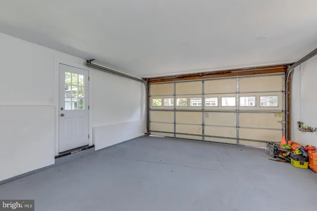 a view of a house with backyard porch and sitting area