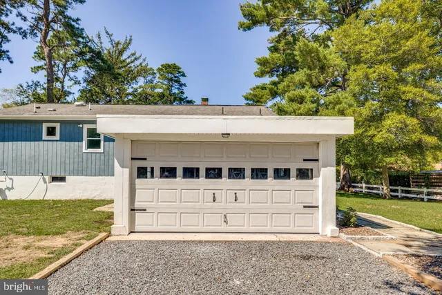 a view of a swimming pool with a lounge chair