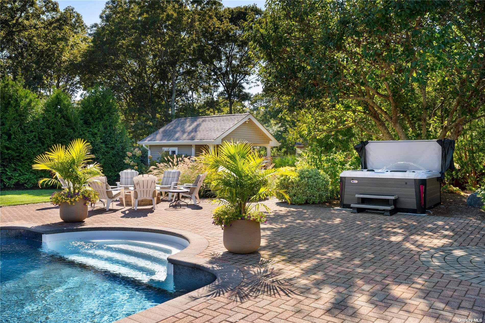 60 Lynncliff Road Hampton Bays, NY 11946 - Photo 14 of 35 a view of a backyard with couches and a fire pit