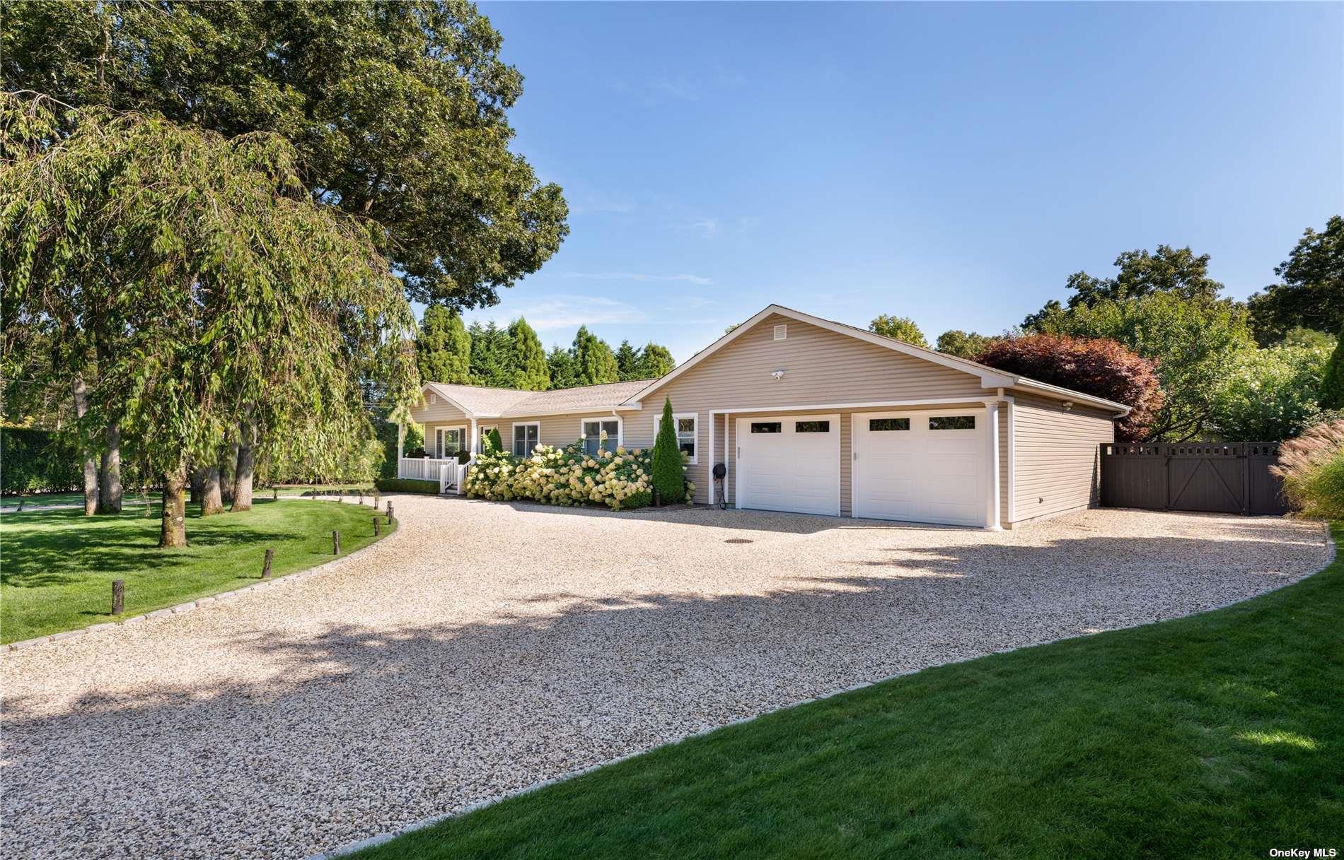 60 Lynncliff Road Hampton Bays, NY 11946 - Photo 2 of 35 a front view of house with yard and green space