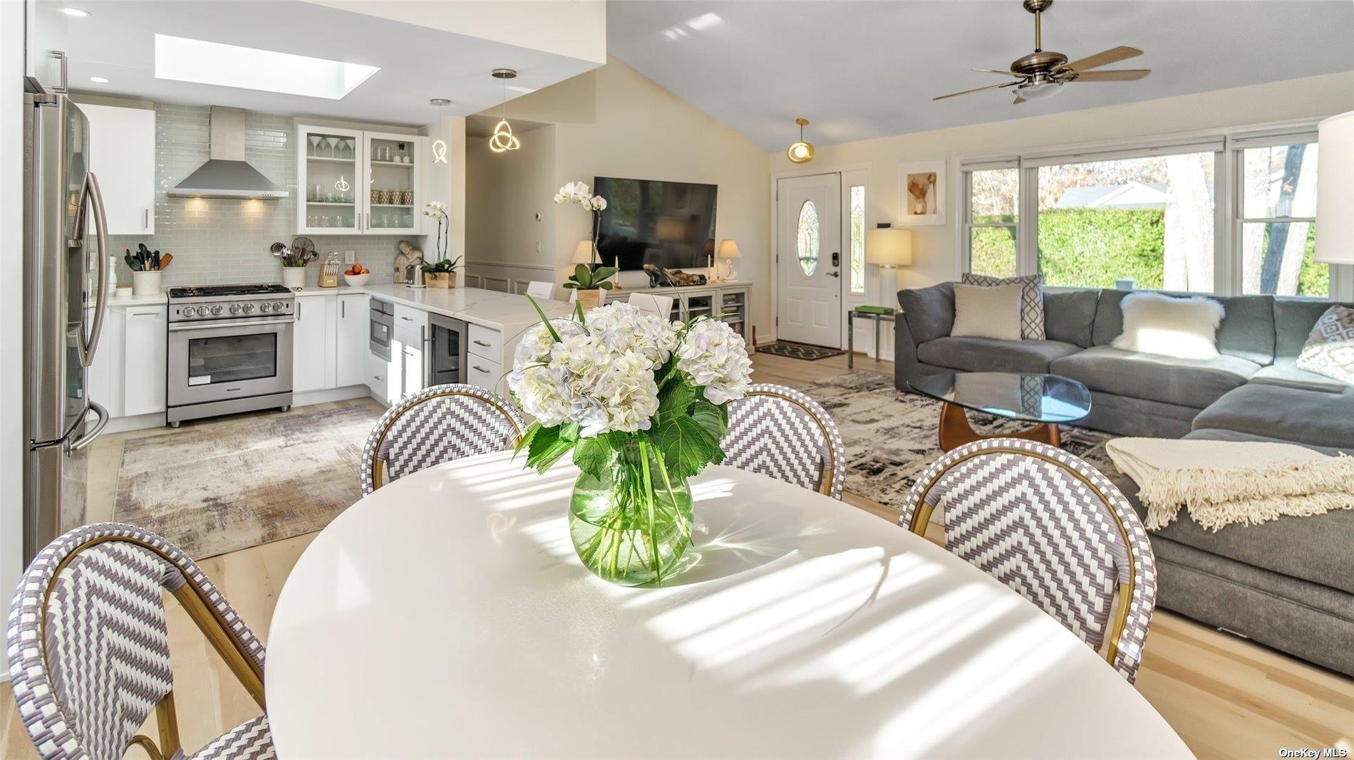 60 Lynncliff Road Hampton Bays, NY 11946 - Photo 23 of 35 a view of a livingroom with furniture and a flat screen tv