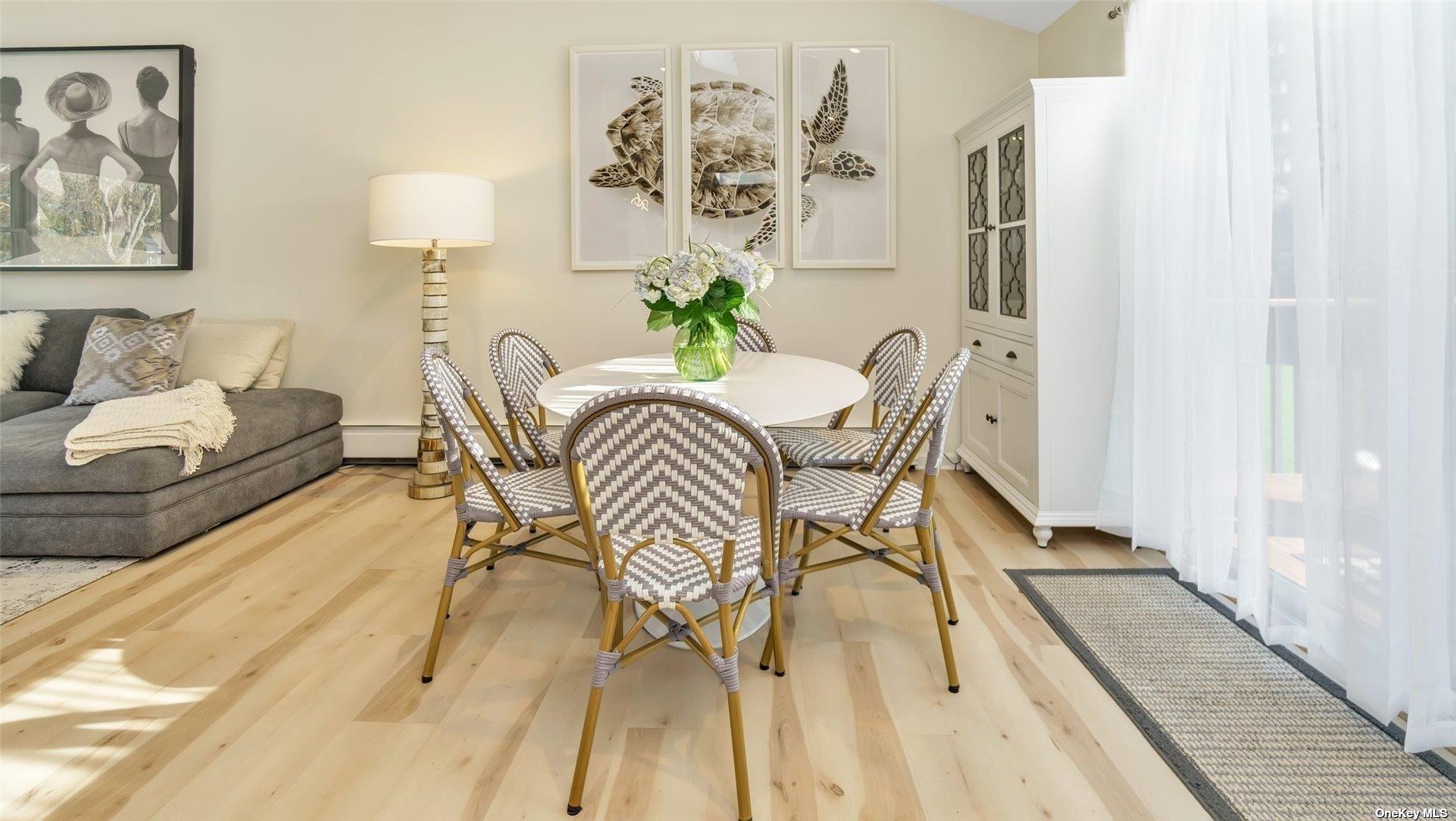 60 Lynncliff Road Hampton Bays, NY 11946 - Photo 24 of 35 a dining room with furniture and wooden floor