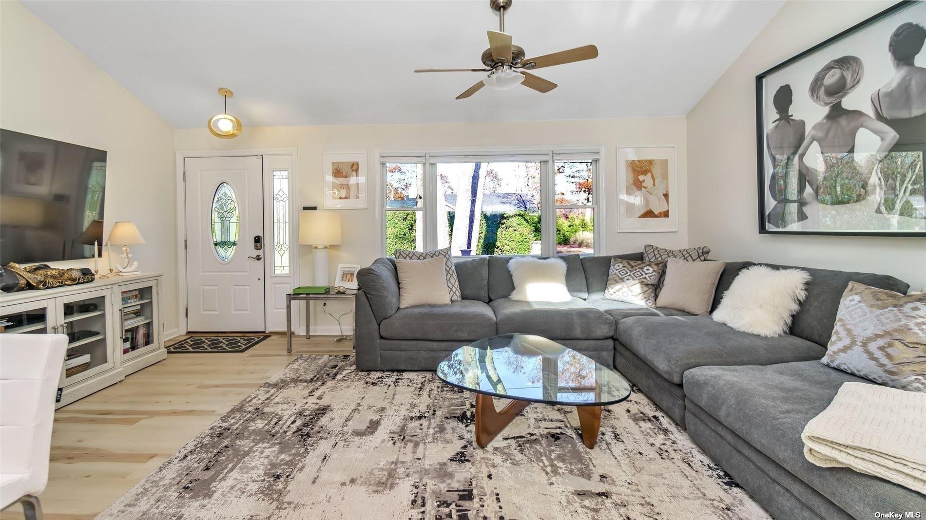 60 Lynncliff Road Hampton Bays, NY 11946 - Photo 26 of 35 a living room with furniture and a flat screen tv