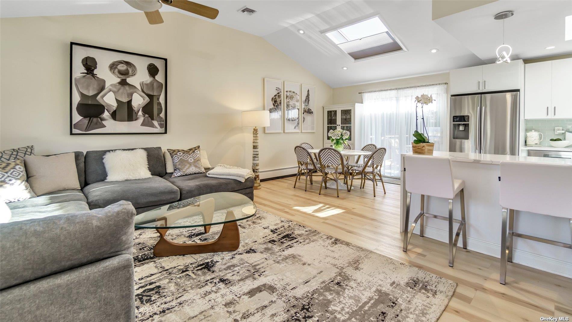 60 Lynncliff Road Hampton Bays, NY 11946 - Photo 27 of 35 a living room with furniture and wooden floor