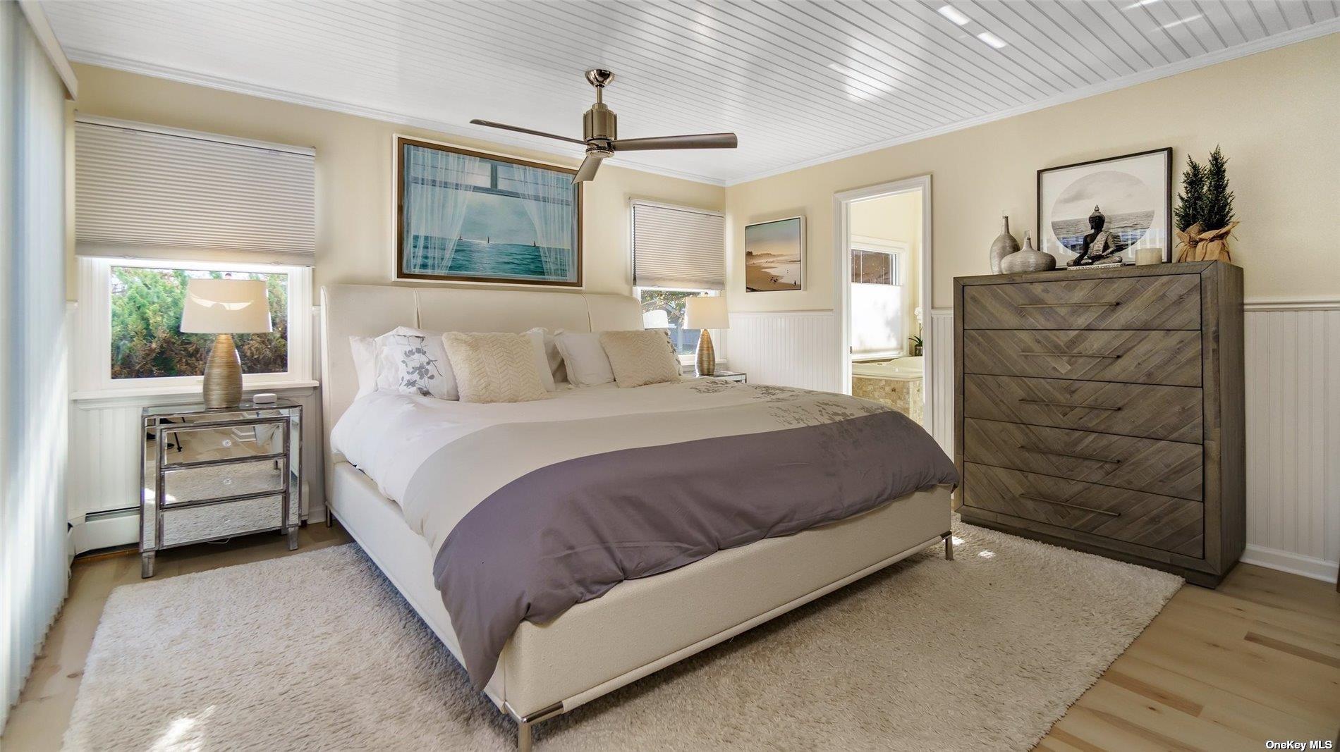 60 Lynncliff Road Hampton Bays, NY 11946 - Photo 29 of 35 a bedroom with a bed and a dresser