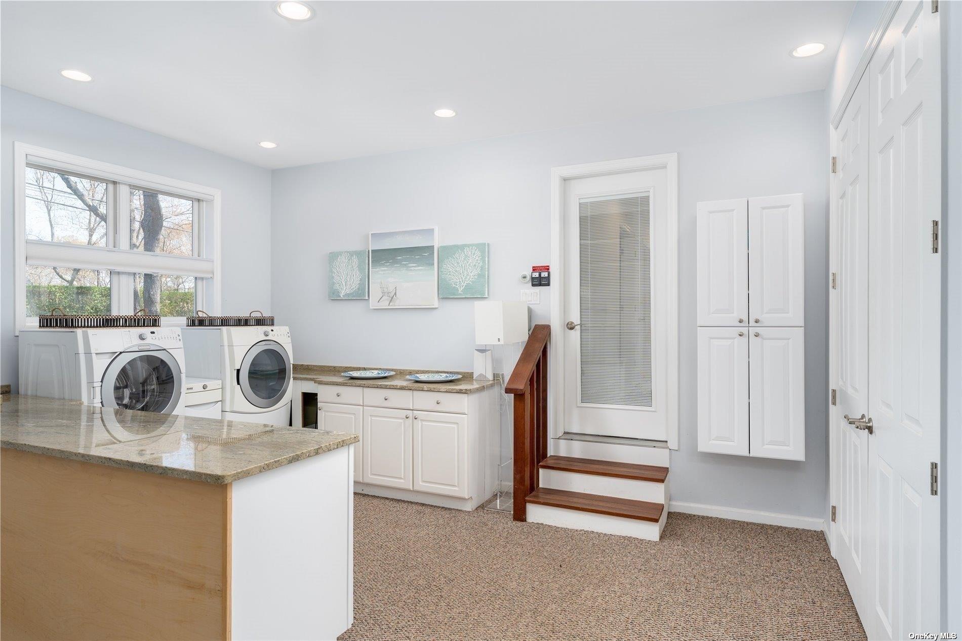 60 Lynncliff Road Hampton Bays, NY 11946 - Photo 35 of 35 a kitchen with granite countertop white cabinets and white appliances