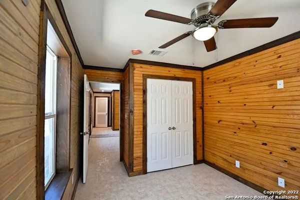 a view of a hallway with a door
